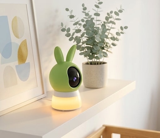 Securidou video baby monitor placed on a shelf, away from the baby's cot