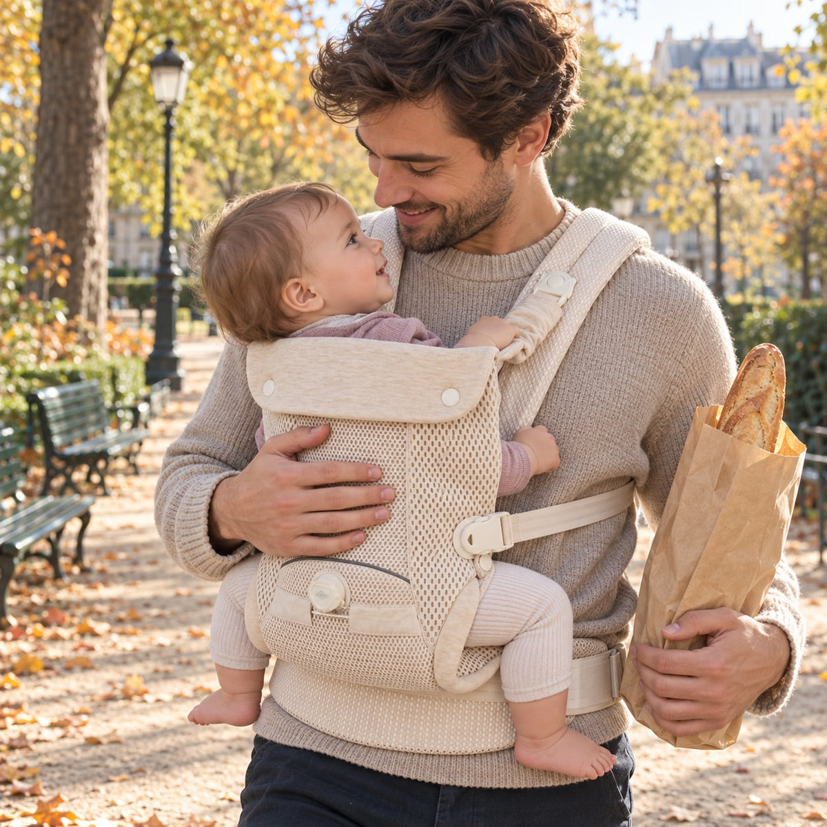 Father walking with his baby facing him in the beige Securidou ergonomic baby carrier, hands free