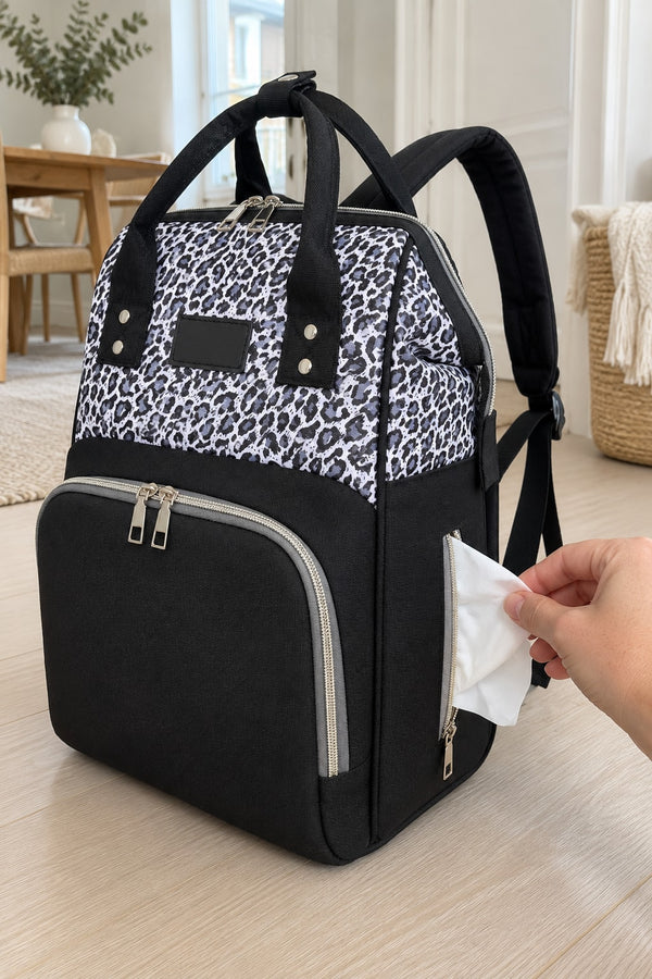 Wipe pulled from the side pocket of the Securidou leopard diaper bag backpack