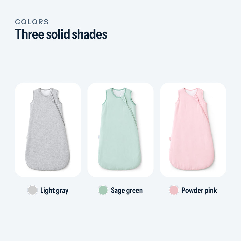 The three colors of the sleep sack: light gray, sage green, powder pink