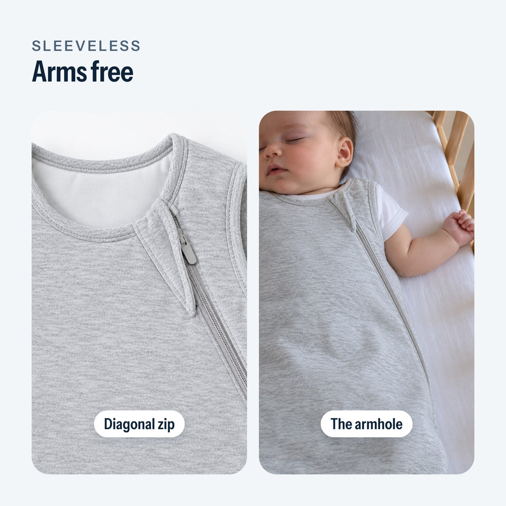 Diagonal zip of the sleep sack, then the armhole on a sleeping baby