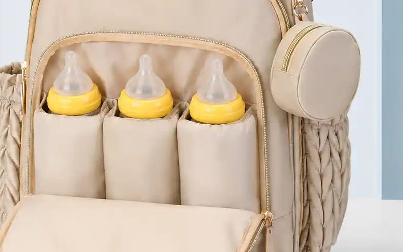 Insulated pockets of the Securidou diaper bag backpack, with three bottles stored