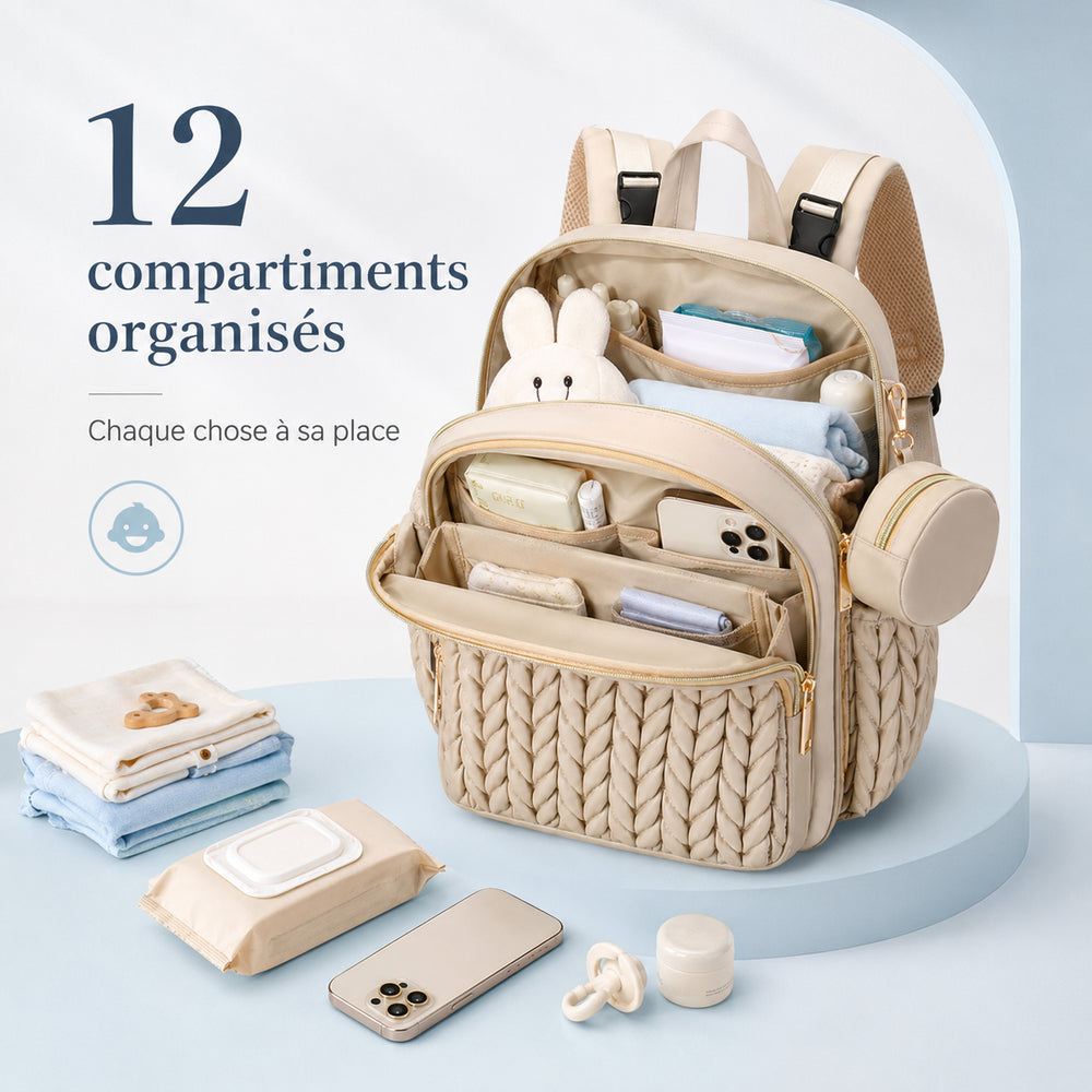 Securidou diaper bag backpack in beige, open to show its 12 organised compartments filled with your baby's things
