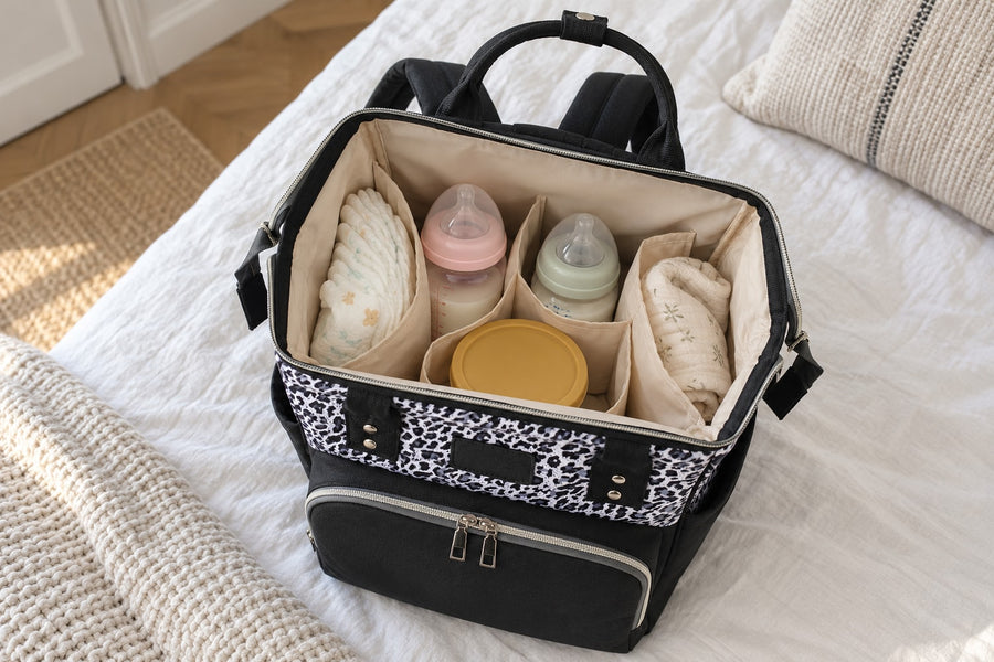 Securidou leopard diaper bag backpack open, with diapers and bottles packed